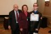 Dr. Nagib Callaos, General Chair, giving Dra. Deisy Mohr Bäuml (accompanied by her son Alessander Bäuml) the best paper award certificate of the session "Informática y Cibernética en Ciencia e Ingeniería II." The title of the awarded paper is "Síndrome de Microcefalia Intervención Humana Tecnológica Salud - Educación – Informática – Ingeniería – Accesibilidad."